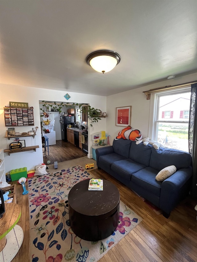 living area with hardwood / wood-style flooring