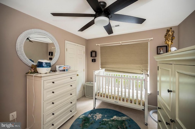 6733 Averett Ct, Fredericksburg, VA 22407 - bedroom with a crib, visible vents, ceiling fan, and light colored carpet