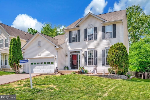 6733 Averett Ct, Fredericksburg, VA 22407 - colonial home featuring driveway, fence, an attached garage, a shingled roof, and a front lawn