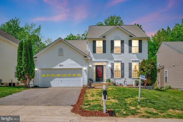 6733 Averett Ct, Fredericksburg, VA 22407 - view of front of property with a lawn, a shingled roof, driveway, and a garage