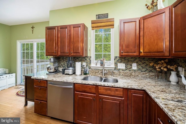 6733 Averett Ct, Fredericksburg, VA 22407 - kitchen featuring a sink, light stone counters, dishwasher, backsplash, and light wood-style floors