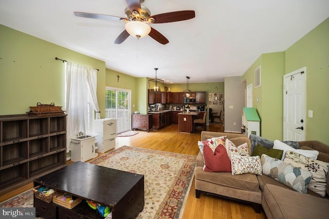 6733 Averett Ct, Fredericksburg, VA 22407 - living room featuring visible vents, light wood-style flooring, and a ceiling fan