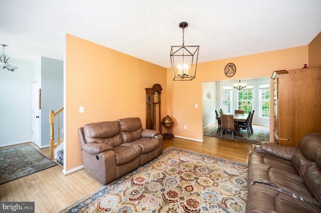 6733 Averett Ct, Fredericksburg, VA 22407 - living area featuring baseboards, an inviting chandelier, and wood finished floors