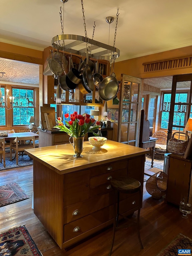kitchen featuring wooden counters, hardwood / wood-style flooring, and ornamental molding