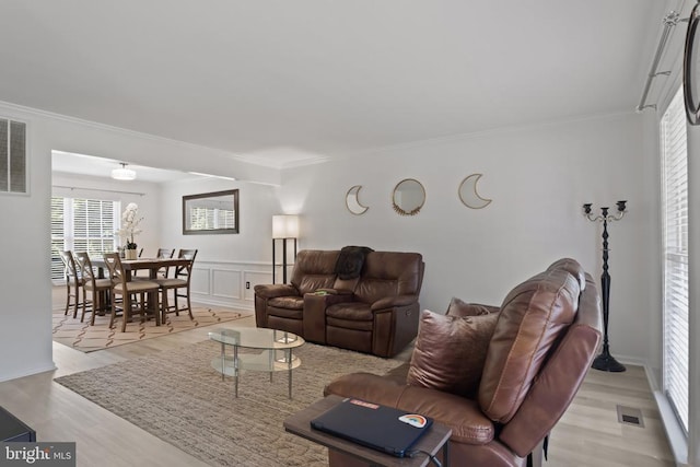 11721 Hoover Ln, Fredericksburg, VA 22407 - living area featuring ornamental molding, light wood finished floors, and a wainscoted wall