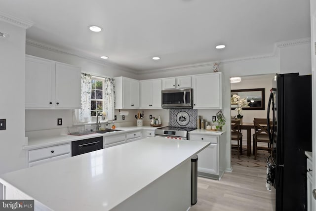 11721 Hoover Ln, Fredericksburg, VA 22407 - kitchen with black appliances, light wood-type flooring, white cabinetry, light countertops, and recessed lighting
