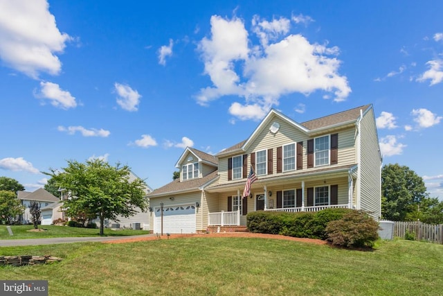 11721 Hoover Ln, Fredericksburg, VA 22407 - colonial house with a porch, driveway, and an attached garage