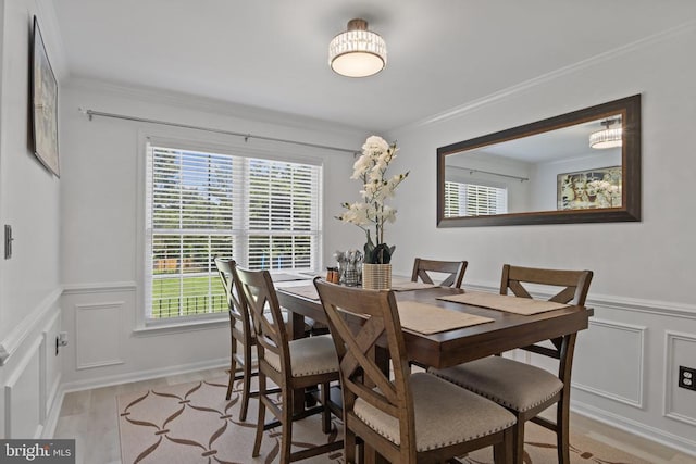 11721 Hoover Ln, Fredericksburg, VA 22407 - dining area featuring a decorative wall, healthy amount of natural light, ornamental molding, and wainscoting