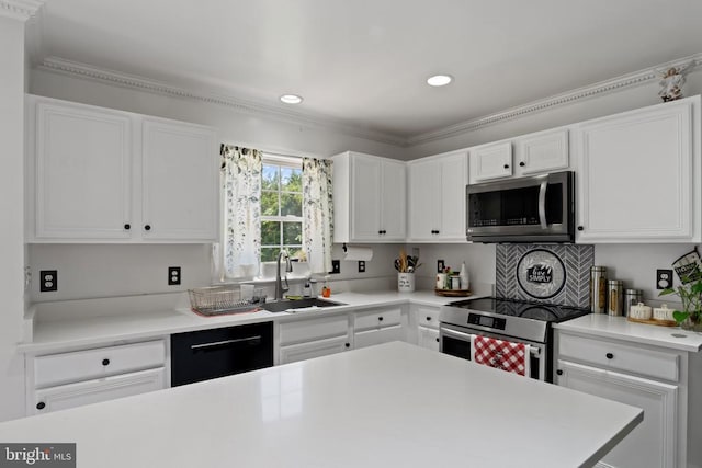 11721 Hoover Ln, Fredericksburg, VA 22407 - kitchen with stainless steel appliances, light countertops, white cabinetry, recessed lighting, and crown molding