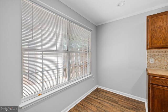11260 Girven Ct, Fredericksburg, VA 22407 - unfurnished dining area featuring dark wood-style floors and crown molding