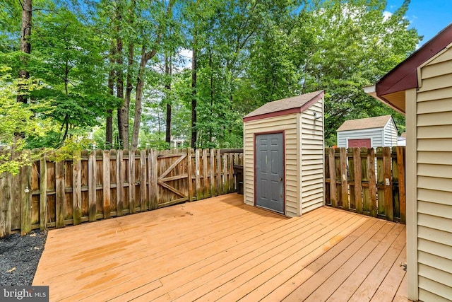 11260 Girven Ct, Fredericksburg, VA 22407 - wooden terrace featuring a shed, a fenced backyard, and view of scattered trees