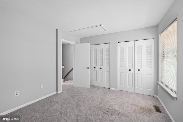 11260 Girven Ct, Fredericksburg, VA 22407 - unfurnished bedroom with attic access, two closets, and carpet