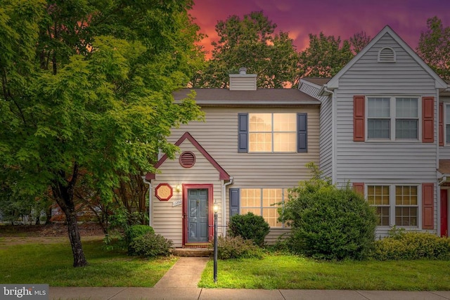 11260 Girven Ct, Fredericksburg, VA 22407 - view of front of home with a chimney and a yard
