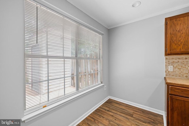 11260 Girven Ct, Fredericksburg, VA 22407 - unfurnished dining area featuring dark wood-style floors and crown molding