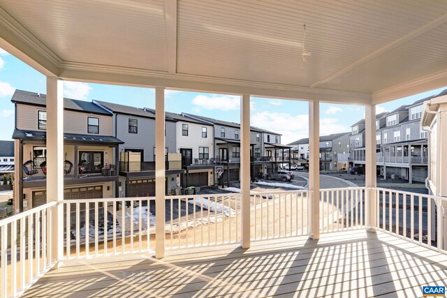 wooden deck with a residential view