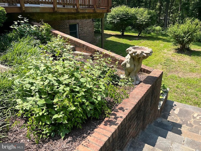 - view of green lawn featuring a wooden deck