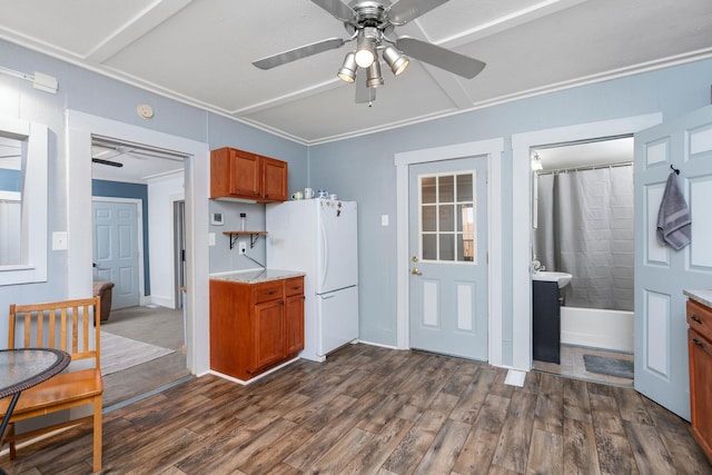 143 Pkin Ln, Raphine, VA 24472 - kitchen featuring freestanding refrigerator, ceiling fan, brown cabinetry, dark wood-style floors, and ornamental molding