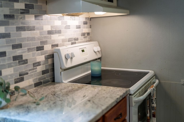 143 Pkin Ln, Raphine, VA 24472 - kitchen featuring electric range, range hood, brown cabinetry, and tasteful backsplash