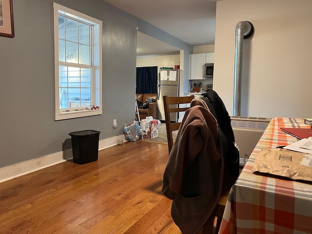 3090 Deerfield Valley Rd, Deerfield, VA 24432 - dining space featuring wood finished floors, baseboards, and radiator heating unit