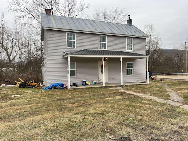 3090 Deerfield Valley Rd, Deerfield, VA 24432 - view of front of house featuring metal roof, a front lawn, a standing seam roof, and a chimney