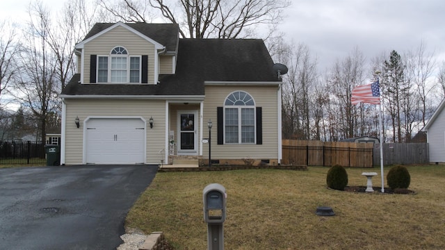 view of front of home featuring driveway, crawl space, a front yard, and fence