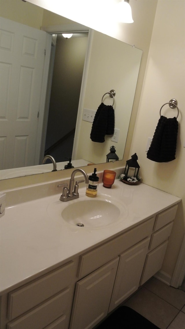 bathroom featuring tile patterned flooring and vanity