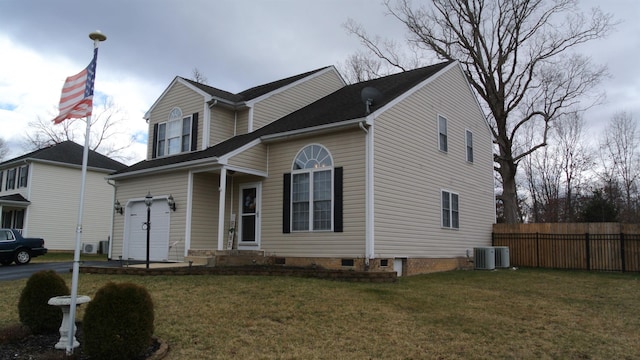 traditional home with fence, a front lawn, and central air condition unit