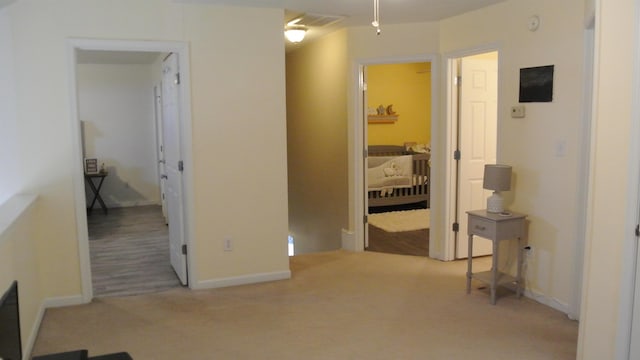 interior space with carpet floors and baseboards