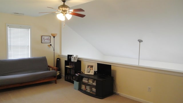 living area featuring carpet, visible vents, ceiling fan, and baseboards