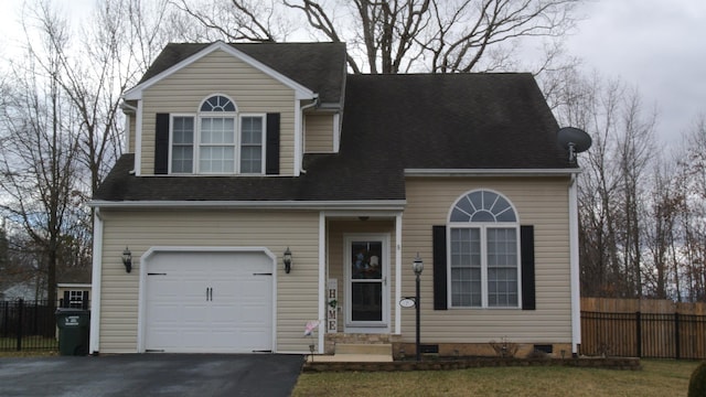 view of front facade with a shingled roof, an attached garage, crawl space, fence, and driveway