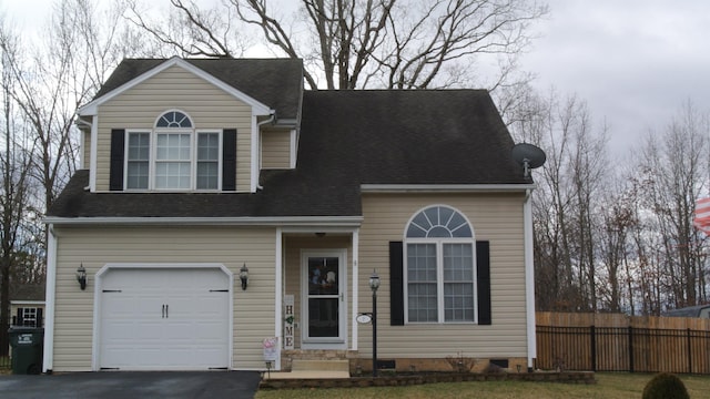 view of front of property with a garage, driveway, roof with shingles, crawl space, and fence