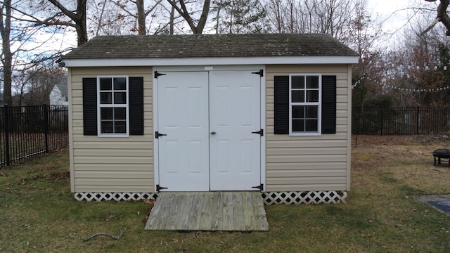 view of shed featuring a fenced backyard