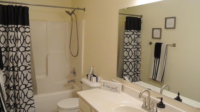 full bath featuring toilet, shower / bath combo with shower curtain, and vanity