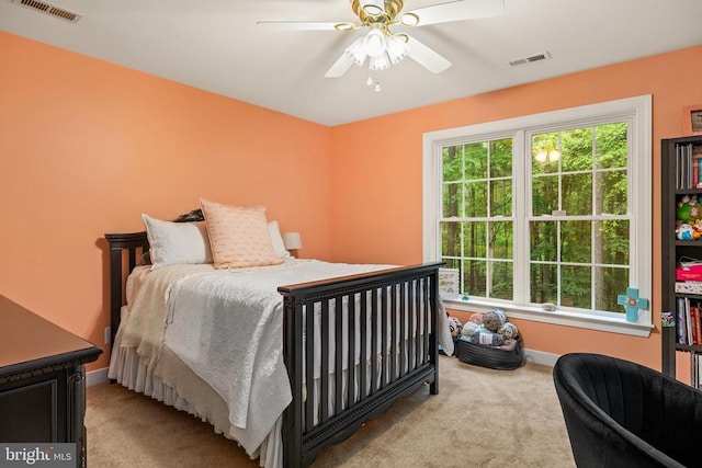 bedroom with carpet floors, baseboards, and ceiling fan