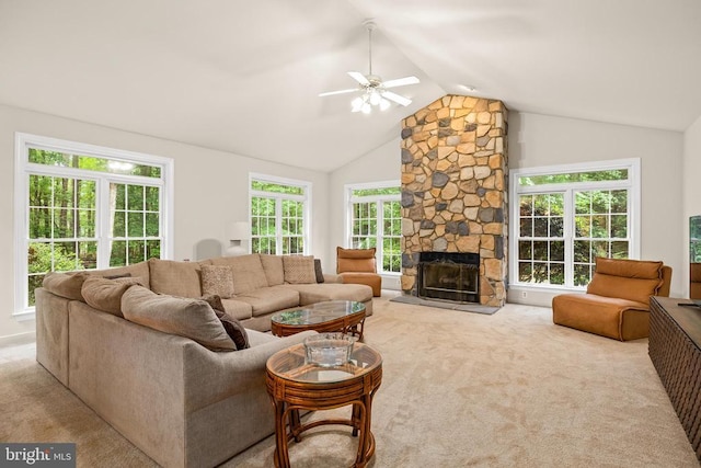 carpeted living area with vaulted ceiling, ceiling fan, and a fireplace