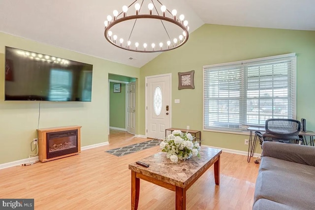 4 Brumback Ave, Luray, VA 22835 - living area with lofted ceiling, wood finished floors, and a chandelier