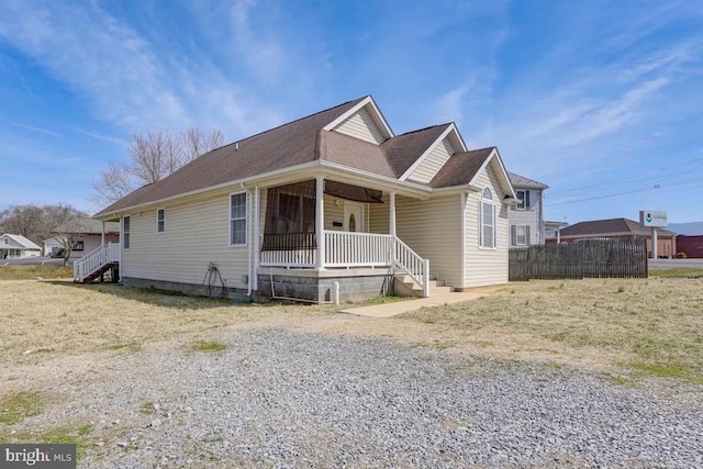 4 Brumback Ave, Luray, VA 22835 - view of front facade featuring covered porch, gravel driveway, and roof with shingles