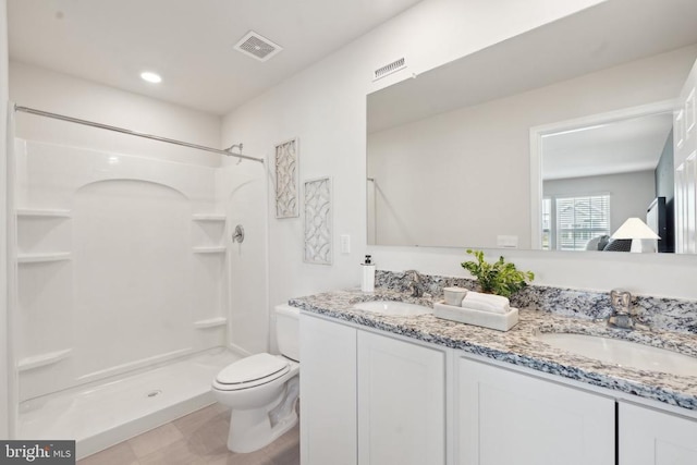 100 Rae Ct, Luray, VA 22835 - bathroom with toilet, a shower stall, and double vanity