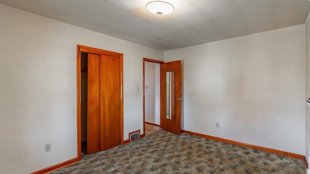 338 Fairfax Ave, Elkton, VA 22827 - unfurnished bedroom featuring a closet, baseboards, and carpet flooring
