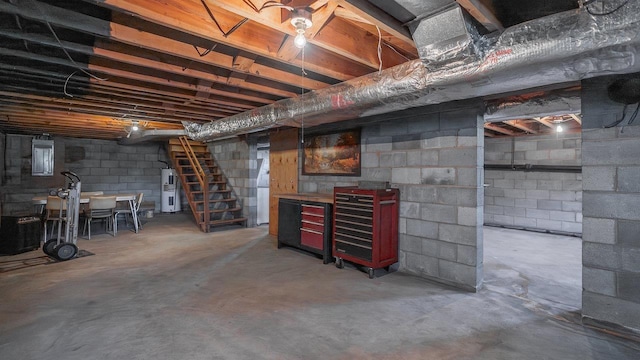 338 Fairfax Ave, Elkton, VA 22827 - unfinished basement featuring stairway and water heater