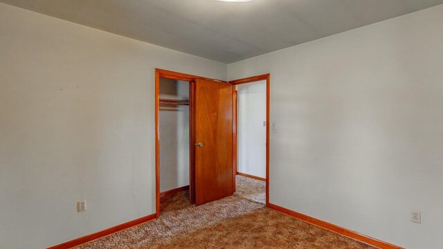 338 Fairfax Ave, Elkton, VA 22827 - unfurnished bedroom with carpet, a closet, and baseboards