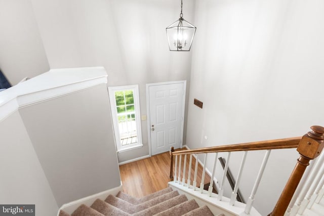 11608 Brian Dr, Fredericksburg, VA 22407 - foyer entrance with a chandelier, stairway, wood finished floors, and baseboards
