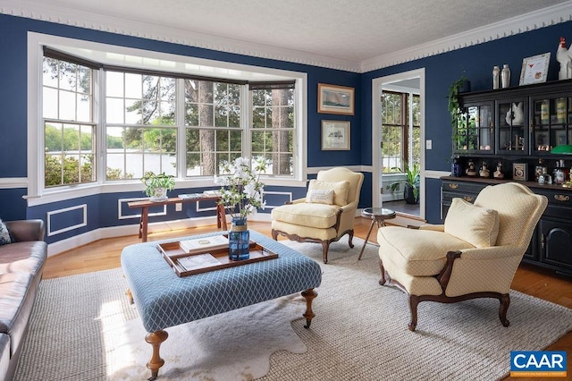 25 Bolling Cir, Palmyra, VA 22963 - sitting room featuring plenty of natural light, crown molding, wood finished floors, and a textured ceiling