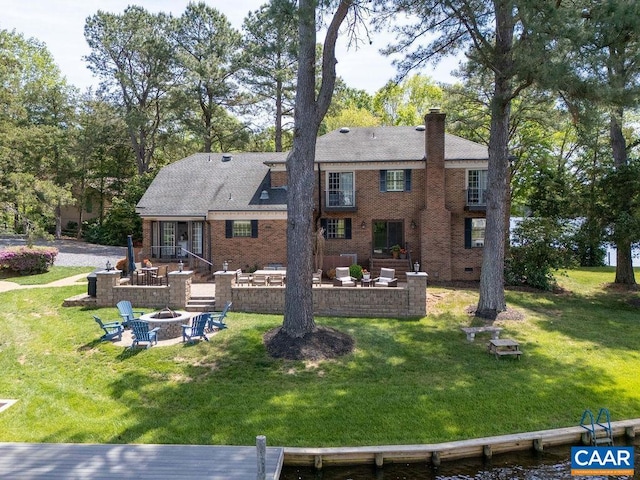 25 Bolling Cir, Palmyra, VA 22963 - back of property featuring a patio area, a chimney, a lawn, and an outdoor living space with a fire pit