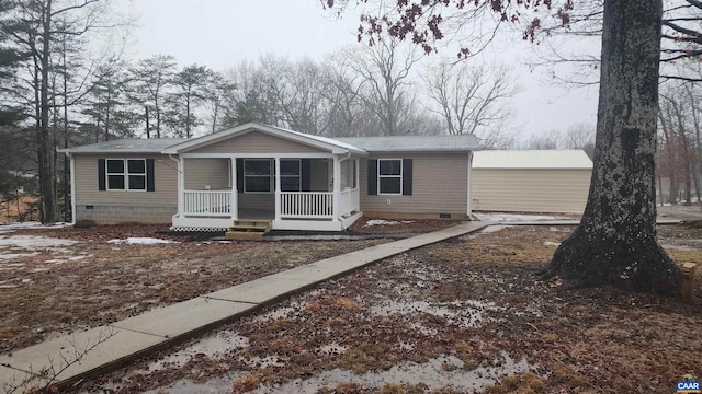 view of front of home with a porch and crawl space