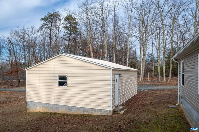 view of property exterior with an outbuilding and crawl space