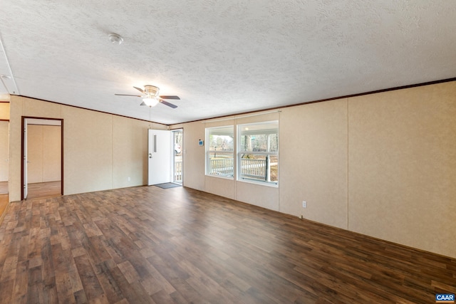 unfurnished living room with a ceiling fan, ornamental molding, a textured ceiling, and wood finished floors