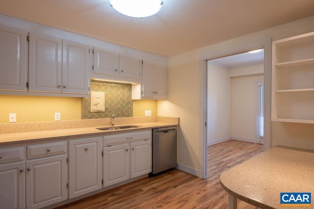 217 E Jefferson St, Charlottesville, VA 22902 - kitchen with dishwasher, white cabinetry, light wood-type flooring, and tasteful backsplash