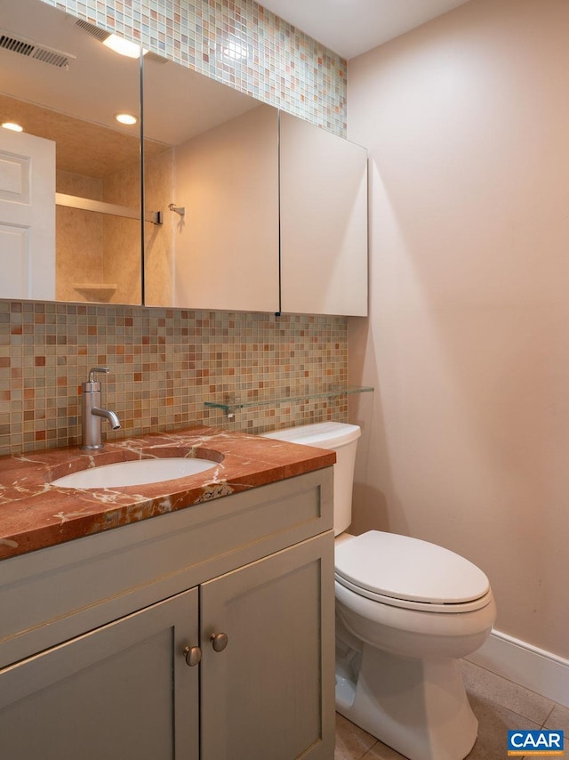 217 E Jefferson St, Charlottesville, VA 22902 - bathroom with a tile shower, vanity, backsplash, tile patterned floors, and recessed lighting