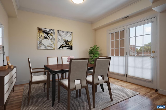 217 E Jefferson St, Charlottesville, VA 22902 - dining room with ornamental molding and light wood-style floors